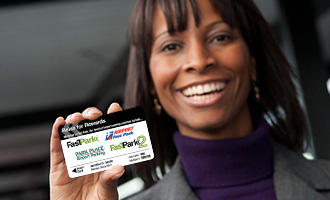 Man Holding Rewards Card